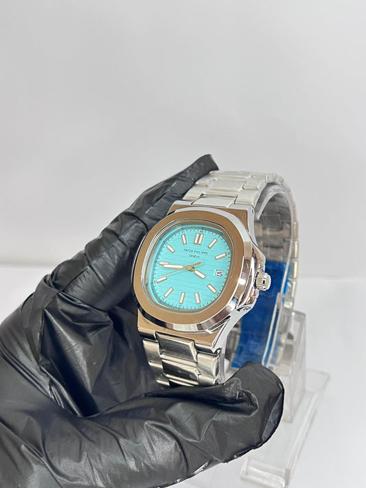 Patek Philippe Silver Chain Watch With Aqua Dial And Date